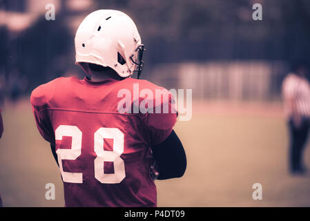 Toned image of an American Football player in action Stock Photo