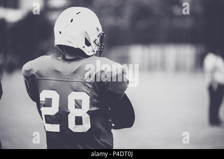 Toned image of an American Football player in action Stock Photo