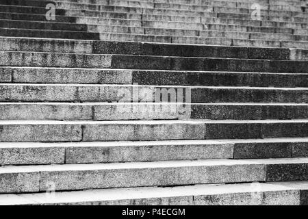 Abstract architecture fragment. Old stairway made of gray granite stone blocks, with decorative pattern Stock Photo