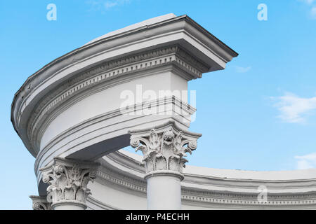 Classical round portico fragment, white columns under blue sky Stock Photo