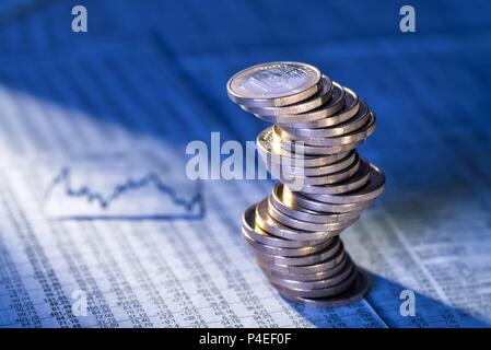 Wobbly stack with euro coins with foreign exchange rates | usage worldwide Stock Photo