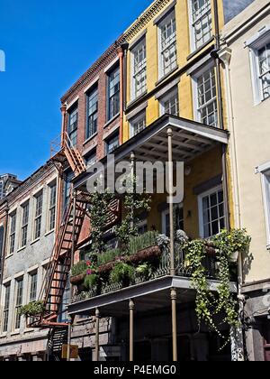 New Orleans, LA USA - May 9, 2018  -  Old French Quarter Buildings with the Flowers and Planters Stock Photo