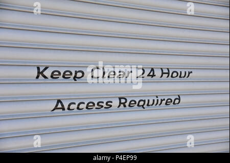 Keep Clear 24 Hour Access Required sign Stock Photo