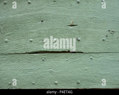 green painted old wooden planks with cracks and nails Stock Photo