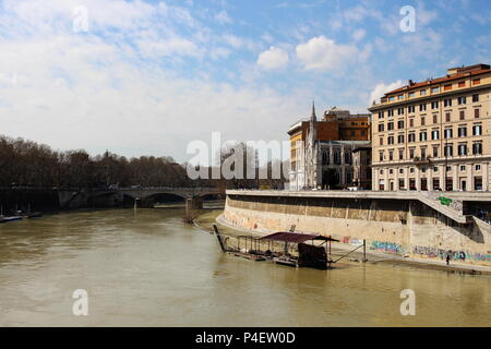 View from Ponte Cavour of the Tiber River over to the French Gothic church housing the Museo delle Anime del Purgatorio Stock Photo