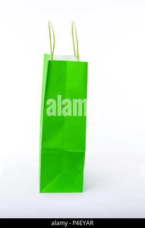 Green paper shopping bags on white background. Empty area. Stock Photo