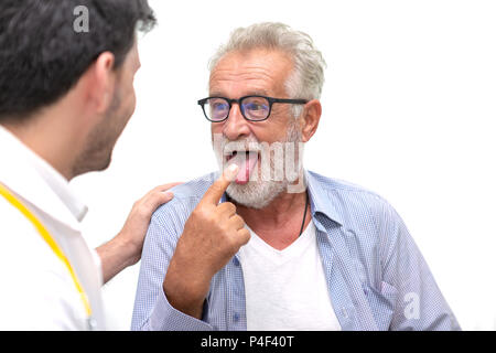 Senior medical doctor or chief doctor giving a consultation to his male patient and explaining medical informations and diagnosis at the clinic or hos Stock Photo