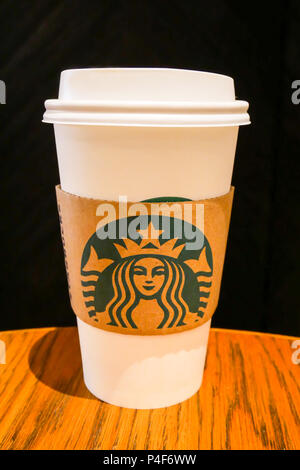 BANGKOK, THAILAND - NOVEMBER 25, 2017: Starbucks mermaid logo on white cup of hot coffee is ready to drink at Starbucks Gaysorn Village Branch in Thai Stock Photo