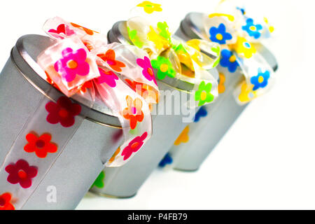 tree beautiful metal gift boxes with colorful bows Stock Photo
