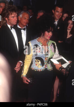 Larry Fortensky with wife Elizabeth Taylor arriving at London Heathrow