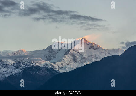 Kangchenjunga mountain at sunrise view from Pelling in Sikkim, India. Kangchenjunga is the third highest mountain in the world. Stock Photo