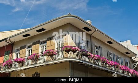 New Orleans, LA USA - May 9, 2018  -  Old French Quarter Building with Balcony with Flowers #7 Stock Photo
