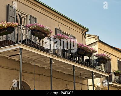 New Orleans, LA USA - May 9, 2018  -  Old French Quarter Buildings with Balcony and Flowers #5 Stock Photo
