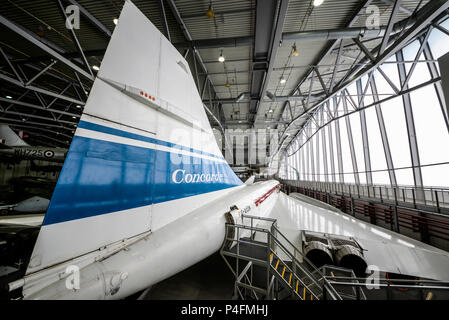 Concorde 101 and aircraft in the Airspace Super Hangar Imperial War Museum Duxford, Cambs, UK. G-AXDN pre production test plane Stock Photo