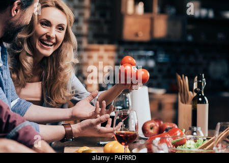 cropped shot of happy middle aged couple preparing dinner together Stock Photo