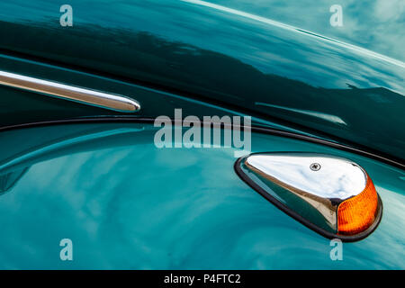 Close-up of reflections in the polished blue green paintwork of a classic Volkswagen Beetle car Stock Photo