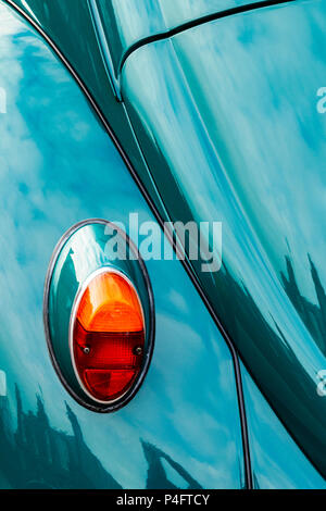 Close-up of reflections in the polished blue green paintwork of a classic Volkswagen Beetle car Stock Photo