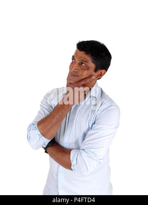 A close up image of a very serious man with his hand on his chin looking confused and puzzled, isolated for white background Stock Photo