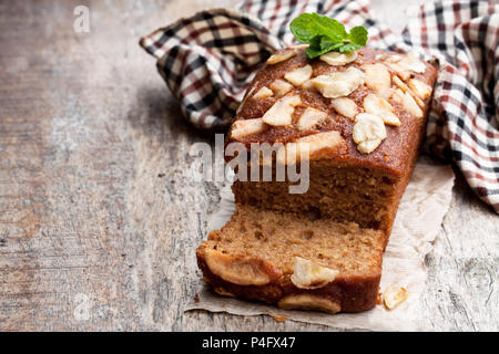 Homemade  banana loaf cake with fresh bananas on wooden table Stock Photo