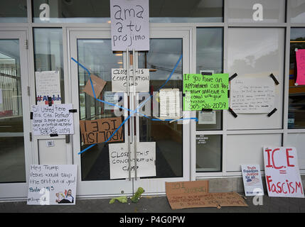Portland, Oregon, USA. 21 June, 2018. The front door of the field office of the United States Immigration and Customs Enforcement (ICE) in Portland, Oregon. The office was blockaded by protestors for several days before stopping operations on June 20. Protestors are objecting to the separation of families detained while seeking asylum on the U.S.-Mexico border.  Credit: Paul Jeffrey/Alamy Live News Stock Photo