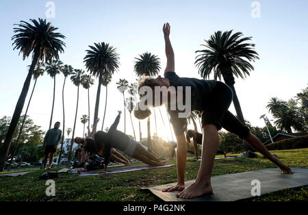 Los Angeles, USA. 21st June, 2018. People practice Yoga during the International Yoga Day at Echo Park near downtown Los Angeles, the United States, on June 21, 2018. Credit: Zhao Hanrong/Xinhua/Alamy Live News Stock Photo