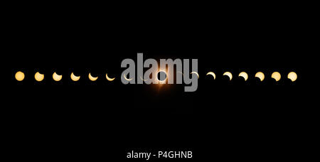 Sequence of total solar eclipse 2017 with exposures bracketed and combined to enhance the solar corona at totality. Stock Photo