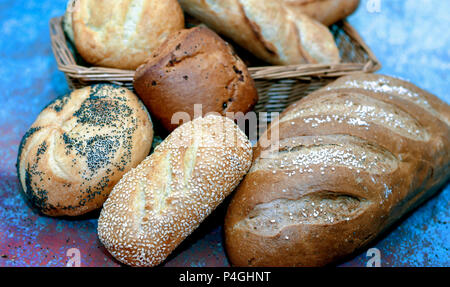 Beautiful bread close up.  Salted rye, french baguette, onion roll, poppy seed, sesame seed, and plain roll Stock Photo