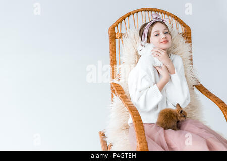 A young girl in underwear with a dreamy expression sitting on a furry  carpet leaning on a cozy sofa Stock Photo - Alamy