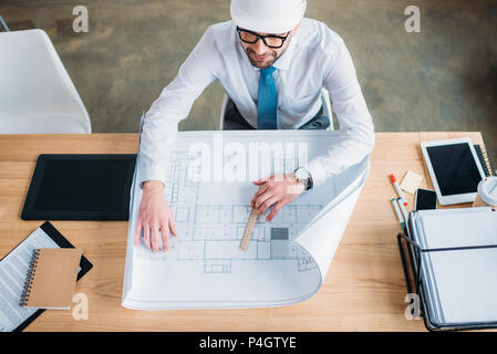 handsome professional architect drawing building plan Stock Photo