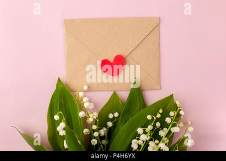 Lily Of The Valley With Heart And Card On Wood Stock Photo