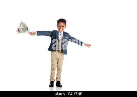 happy african american boy standing with bouquet and open arms on white Stock Photo