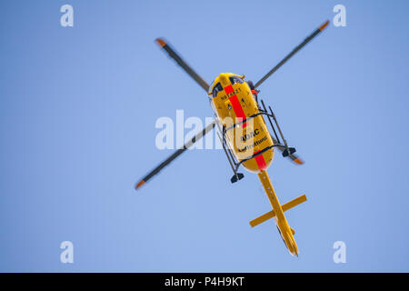 FELDKIRCHEN / GERMANY - JUNE 09, 2018: Eurocopter EC-135 from ADAC Luftrettung flies over landing side. Notarzt means emergency doctor. Stock Photo