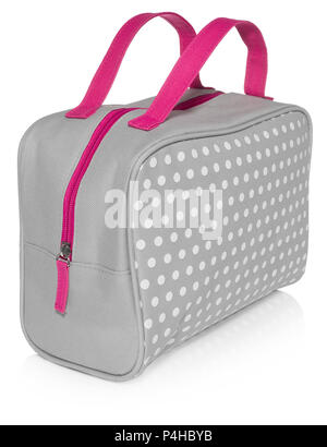Women's beautician to store cosmetics. Purse for women made of gray material with white dots with a pink handle, space for a logo. Fashionable object  Stock Photo