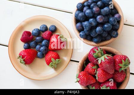 Fresh and easy salad from forest fruit berries (strawberries,blueberries and some raspberries). Top down view Stock Photo