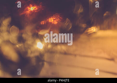 defocused night cityscape. Abstract colored spots in vintage toning. Texture as background Stock Photo