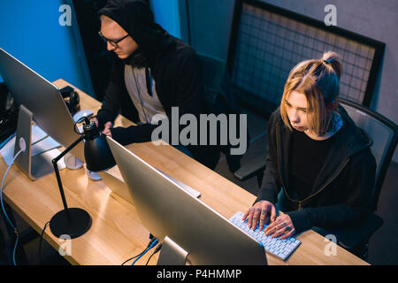 high angle view of couple of hackers working on malware Stock Photo