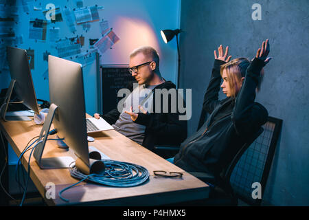 couple of hackers have problem with malware development Stock Photo
