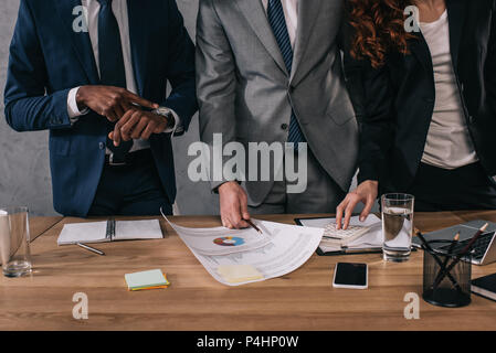 Cropped image of three business colleagues doing paperwork Stock Photo