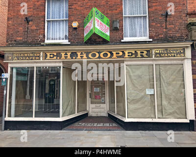 EH Hooper, Silk Mercer & Draper, Millinery & Mantles shop sign in gold lettering, 25 High Street, Bridgwater, Somerset, England, UK, TA6 3BE Stock Photo