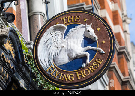 LONDON, UK - FEBRUARY 16TH 2018: A traditional old sign above The Flying Horse public house on Oxford Street in London, on 16th February 2018. Stock Photo