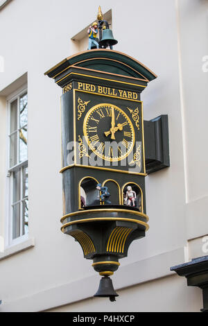 LONDON, UK - FEBRUARY 16TH 2018: The clock above the entrance to Pied Bull Yard, located in the Bloomsbury area of central London, UK, on 16th Februar Stock Photo