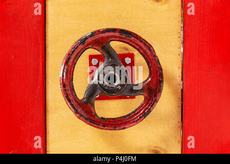 Closing lever in the form of a circle. The valve on the door. Stock Photo