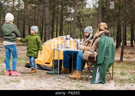 happy young family on camping in forest Stock Photo