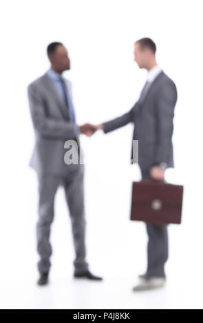 Blurred business people. Handshake of two business men. Stock Photo