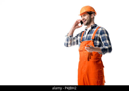 Handyman in orange overall and helmet talking on the phone isolated on white Stock Photo