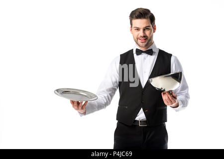 portrait of handsome bearded waiter in suit vest with empty serving tray isolated on white Stock Photo