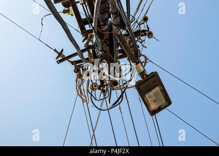 Chaos of cables and wires and broken street lights Stock Photo
