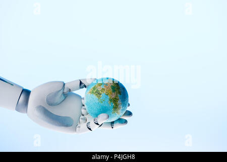 robot hand holding earth model isolated on blue, earth day concept Stock Photo