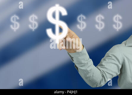 businessman hand pointing to Symbol money of Dollar in your work concept business on  blur blue skyscraper background. Stock Photo