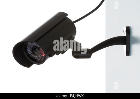 Wall-mounted surveillance camera isolated on white background Stock Photo